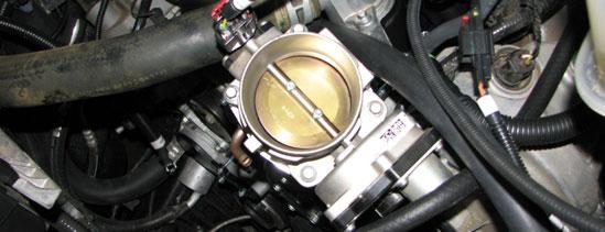 Do not latch the air box cover at this time. 154. Insert the silicone elbow between the throttle body and the MAFS housing and secure it with the supplied worm clamps.