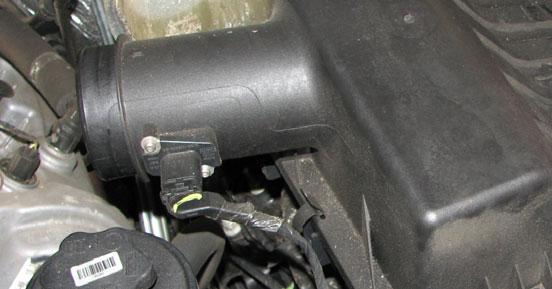 Use a 10mm socket to remove the inlet resonator bolt, then loosen the hose clamp and
