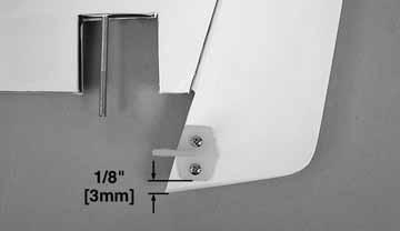 Drill through the marks with a 1/16" [1.6mm] drill bit. Secure the control horn to the rudder using two #2 x 1/2" [12mm] screws. 1. Install a nylon clevis and a clevis retainer on the two steel pushrods.