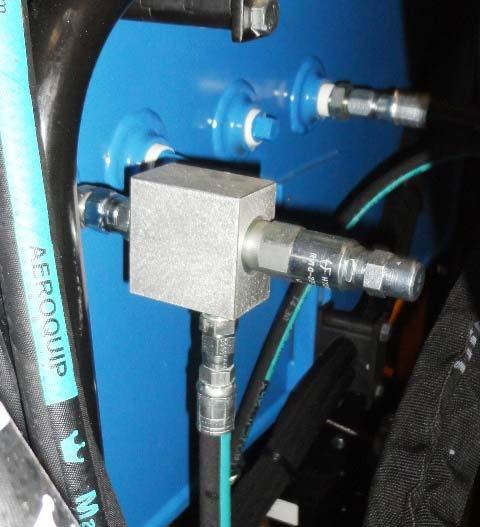 10. Tighten the emergency pump pressure relief valve adjusting screw lock nut and install cap (Figure 71). 11.