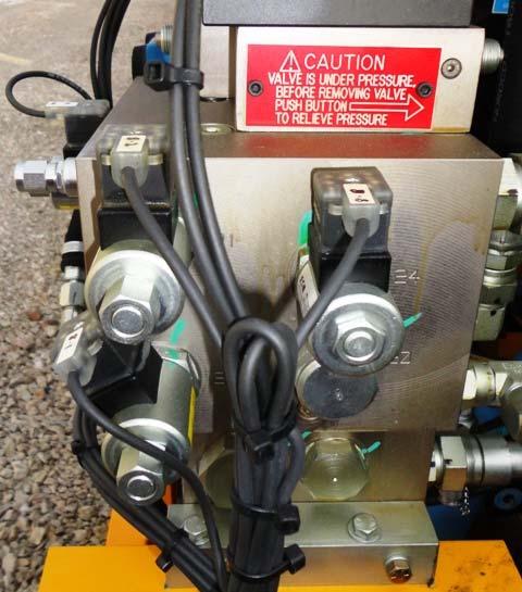 Use caution crack both hose fittings (1/8 1/4) of a turn (CCW) at the gager cylinder (being worked on) to allow any pressurized oil to bleed