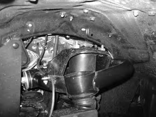 The inner fenderwell sheet metal may need to be slightly formed to get the bolt to be removed easily. Reference factory service manual if necessary. 7. Install new control arm with factory hardware.