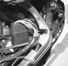 3. Install Custom Harness. A. Locate ignition switch connector, directly behind the ignition switch. Release the red secondary lock.