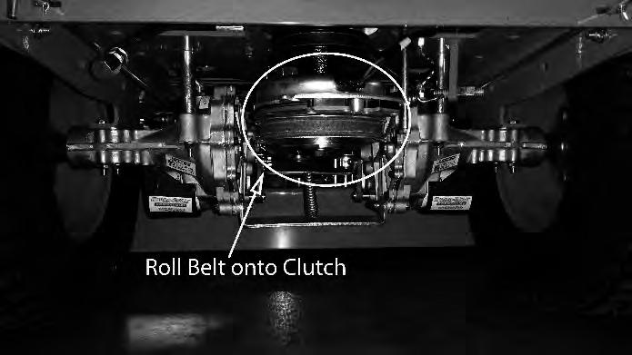 4) While lifting up on the belt (as shown in the photograph), rotate the pulley until the belt is