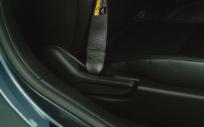 Adjust the seatback position by pulling up the recliner handle (B) and adjusting the seatback forward or rearward. Release the handle to secure the seatback in place.