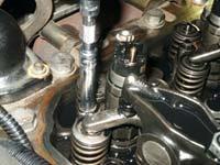 22: Remove 8mm injector hold down bolts. 23: Carefully pry injectors out of injector bore.