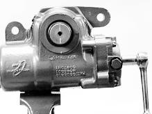 Put the steering gear in a vise, clamping firmly against the housing mounting flange or boss.