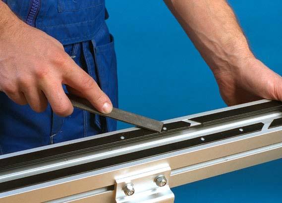 3 Make sure the slide rail surface is smooth and that screws do not protrude over the surface of the slide rail. If the surface should be uneven, file the edges smooth.