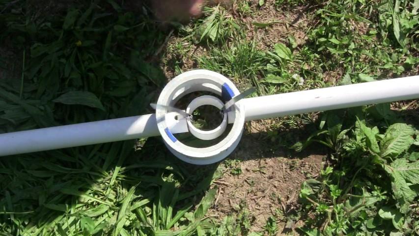 Insert the second strut through the hole on the opposite side of the hub. Zip Tie the second strut to the center ring. This completes the connection.