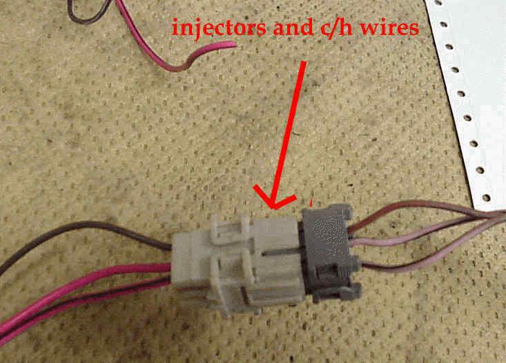 On the injectors harness (picture below) is three more wires. Two are pink (one with black stripe) that need to be fused, with the hot in start and run wire from the vehicle harness.
