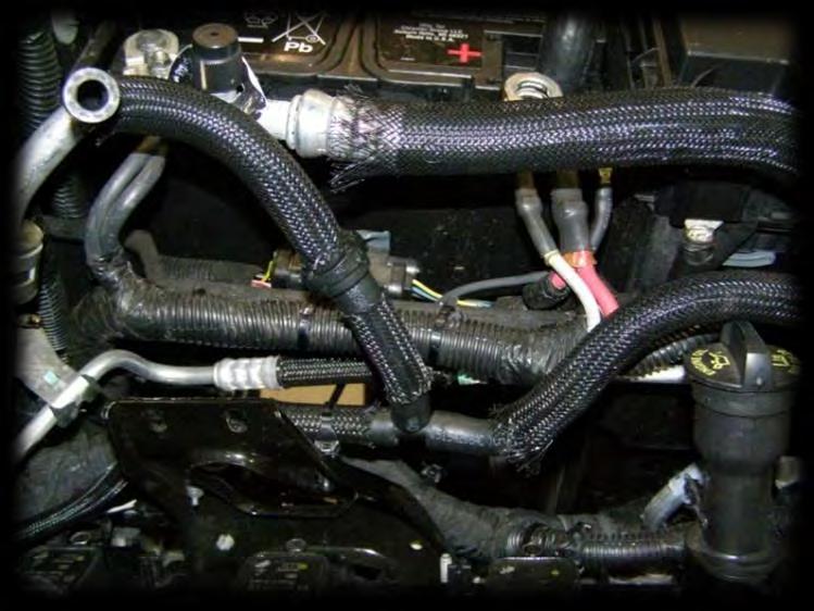13. Install engine breather hoses.