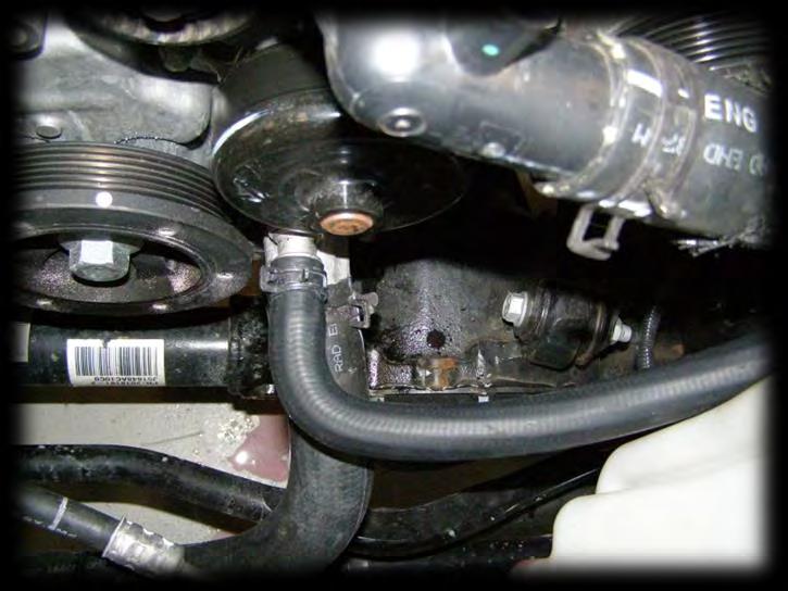 Install the second heater hose,