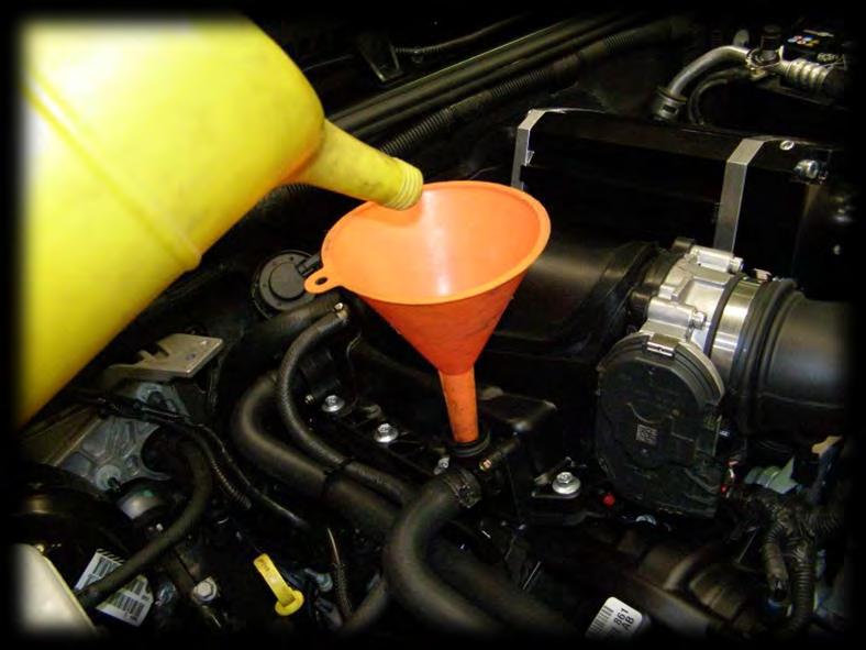 Remove the intercooler fill cap and fill the system with approximately 1.