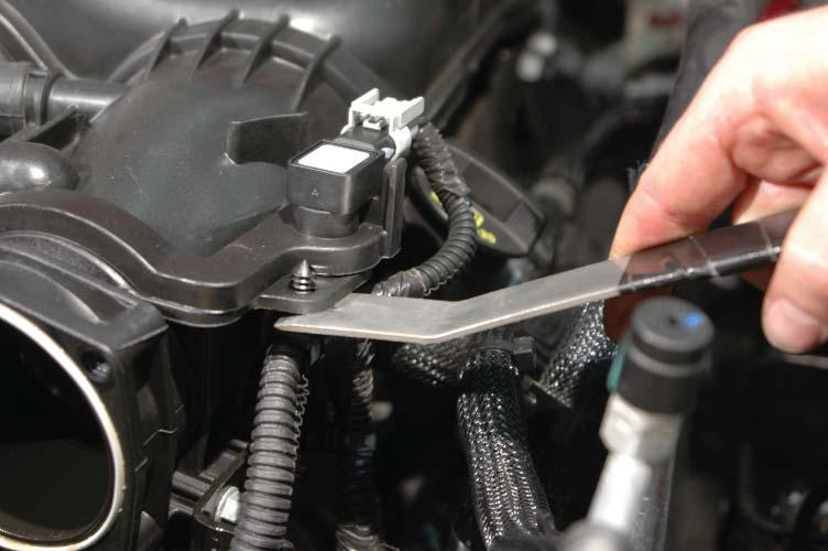 Carefully wipe the throttle body clean and store in a safe place for reinstallation later during the