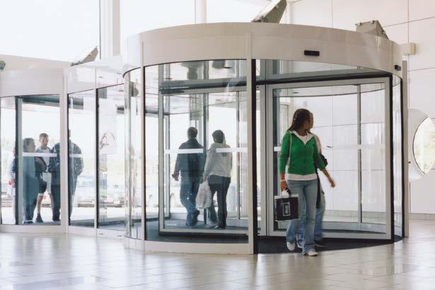 Optional showcases around the center column of the door set allow for customization or advertisements. Twintour Revolving doors force visitors to walk through them in a semi-circle.