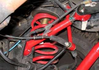 NOTE: Suspension arms may be replaced without lifting vehicle. The suspension arms often align to the mounts better with vehicle on the ground, making simpler to remove and install mounting bolts.