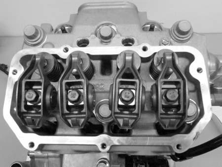 Rocker Arms 1. Remove the valve cover. 2. Mark or tag rocker arms in order of disassembly to keep them in order for reassembly. 5. If the push rod (A) is visibly bent, it should be replaced.