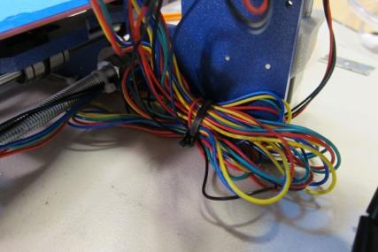 For the wires to the hot-end, HBP, and X-stepper, I like to put black spiral wrap around the wires, and