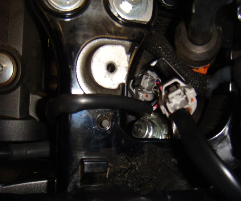 Locate the stock fuel injector (photo 5), disconnect the stock and connect