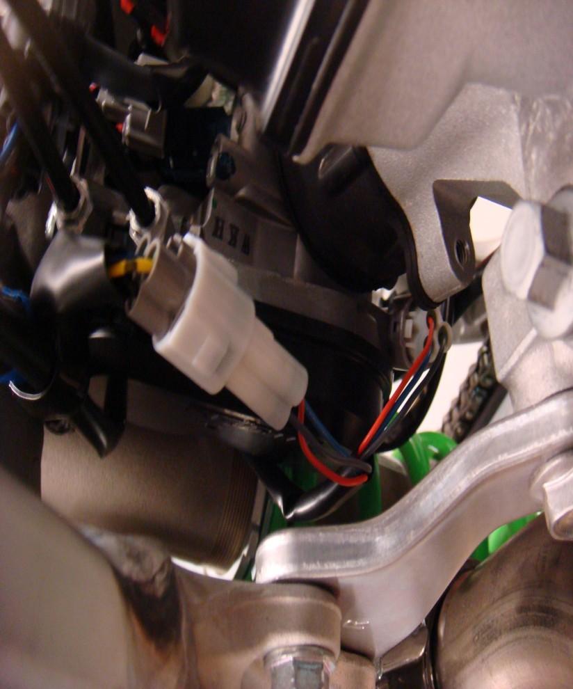 Locate the fuel injector (photo 1), disconnect the stock and connect the harness in-line with the fuel injector and stock.