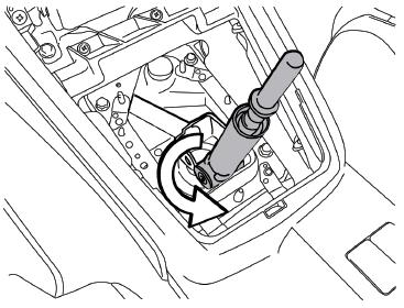 3. Pull the lever back so that you can spin it 180 degrees and pull back on the shift lever as if you were going into 4th gear to pop it out of the plastic cup at the bottom.