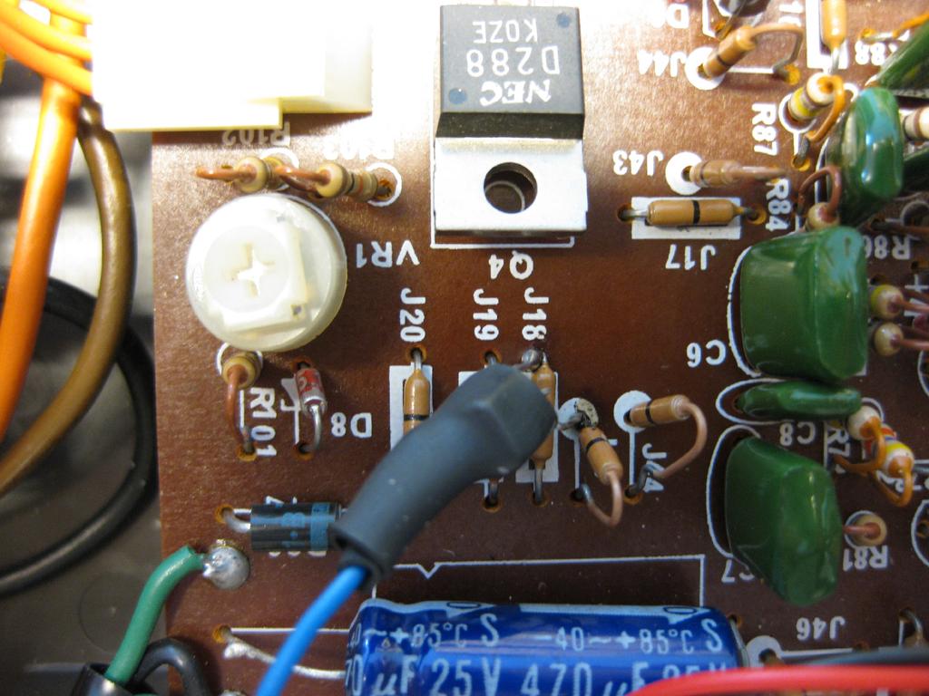 The blue wire with the transistor goes on the left side just below Q4.