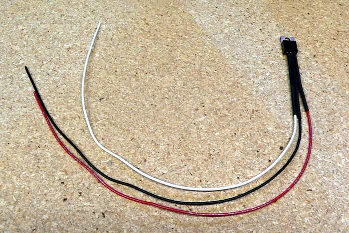 between the head unit wiring harness and the Metra wiring harness. Without the regulator, the subwoofers will pop when the head unit is turned on. So let s wire the regulator first.