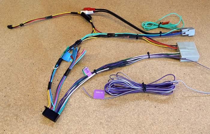 From left to right, when the regulator is in this position, the white wire is the collector (in) and goes to the single blue wire on the head unit wiring harness for the amps.