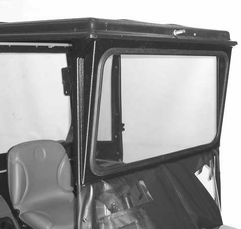 Raise the front of the top and push the windshield back against the frame. Lower the top over the top edge of the windshield trapping it in place. 23 E.