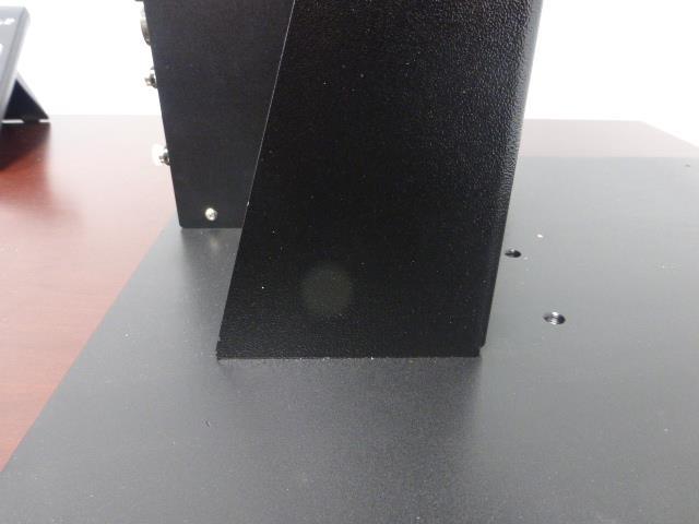 The stand may be positioned fully to the rear, or in the forward mounting holes