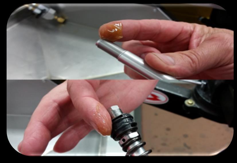 Apply seal and O-ring grease to the rebound rod (the