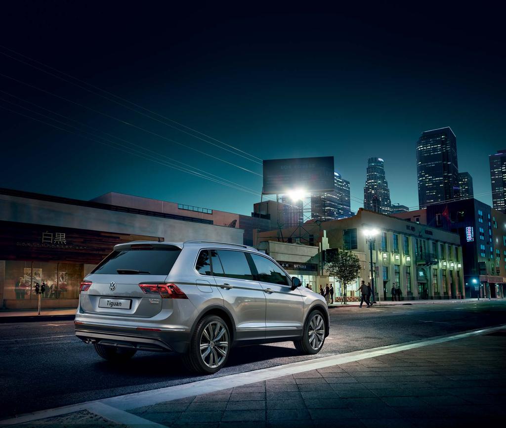 Model shown is Tiguan SEL 4MOTION with optional Outdoor pack, 20" Miramar grey metallic alloy
