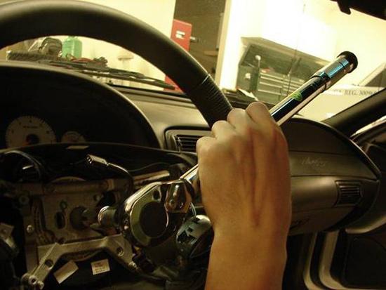 11. Remove the steering wheel bolt using the T50 Torx bit.