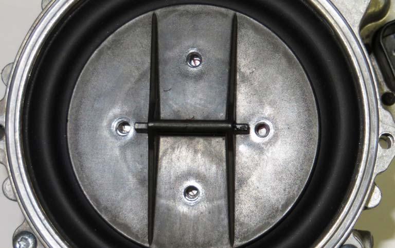 Make sure the diaphragm is seated in its groove completely before installing the clamp plate.
