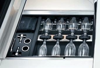 At the car s stern, the lid provides a comfortable table seat for two, with a drinks cabinet and coolbox