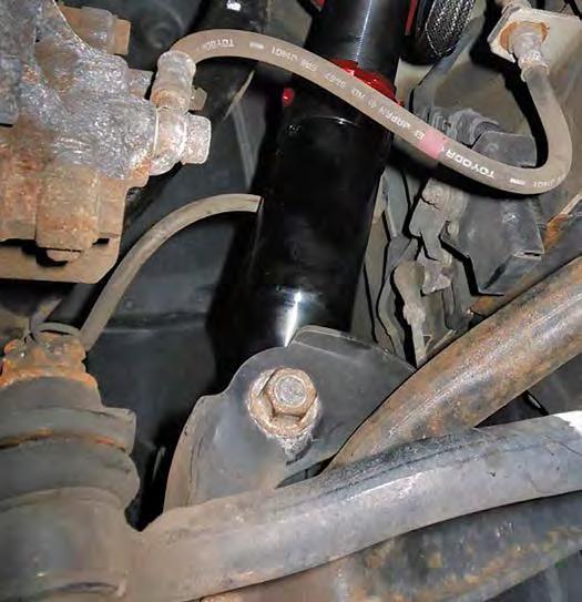 Reattach the spindle to the upper control arm ball joint (fig. 23).