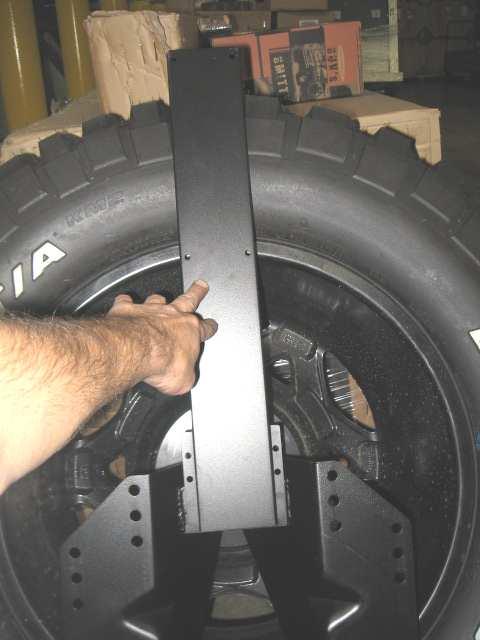 (Fig D) Put the light bracket so the top of it where the light lens will be placed is just above the tire.