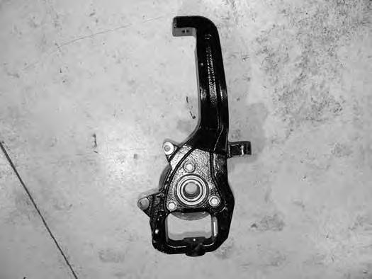 25. Remove the lower ball joint nut and remove the knuckle from the lower control arm. Retain the lower ball joint nut. (Fig 9) 26. Repeat the knuckle removal process on the other side. 27.