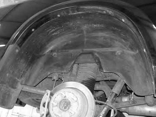 Remove the screws holding the inner fenders to gain access to the air bag fittings. (Fig 33) FIGURE 33 75. Using a wrench remove the air line fitting from the rear bags.