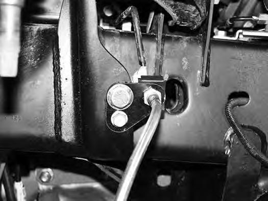 12. Attach the provided brake line relocation bracket (01274) to the frame where the original line mounted.