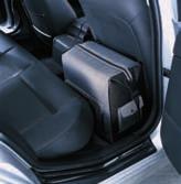Cover made of waterproof leatherette which is simply hooked over the head rests.