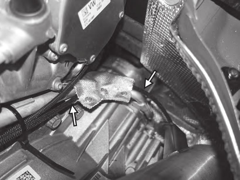 30) Unsnap the cloth heat shield on the right side of the top of the transmission, and route the left APR extension