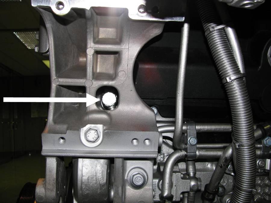 7. Remove M16 x 28 banjo bolt on plastic low pressure fuel line at front of block through access hole in alternator mounting bracket. Do NOT remove the spacer the bolt threads in to.