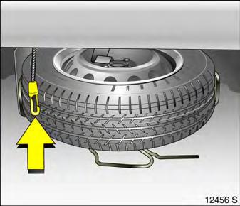 7. Place the replaced wheel in the spare wheel holder with the outside of the wheel facing upwards. 8. Lift the spare wheel holder, insert the safety cable. 9.