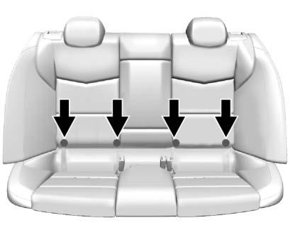 The outboard lower anchors are behind the vertical openings in the seat trim. The top tether anchors are behind the rear seat, on the filler panel. Open the covers to access the anchors.