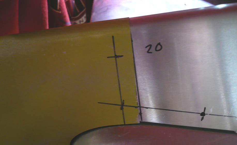 Use a #30 drill bit to expand the holes and cleco. Extend the rivet line from the Rear Fin onto the Forward Fin.