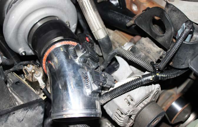 STEP 22 Reconnect the heater hose and upper vent to the vertical coolant