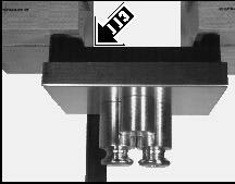 16000B = 16 kg) on position 1 of the weighing platform (120). - Check the setting of the corresponding corner stop (115) using a feeler gauge. There must be a space of 0.