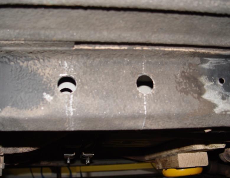 interior supports) until the centering drill bit of the hole saw arbor comes through the ¼ hole.