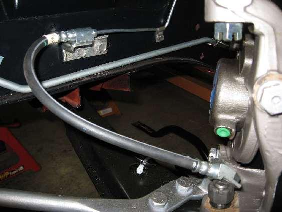 E. Assembly of the under hood components 1. To bench bleed the master cylinder; 2. Secure the master. 3. Remove the master cylinder cap. Fill the reservoir with brake fluid.